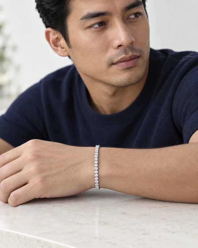 Model wearing the Frost Asia moissanite tennis bracelet in a white-metal finish