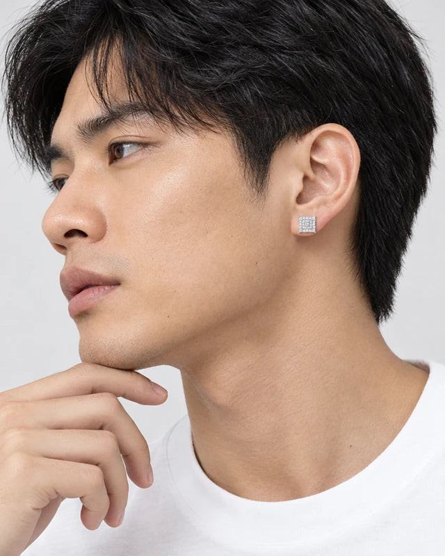 Model wearing the Frost Asia square moissanite stud earring in a white-metal finish