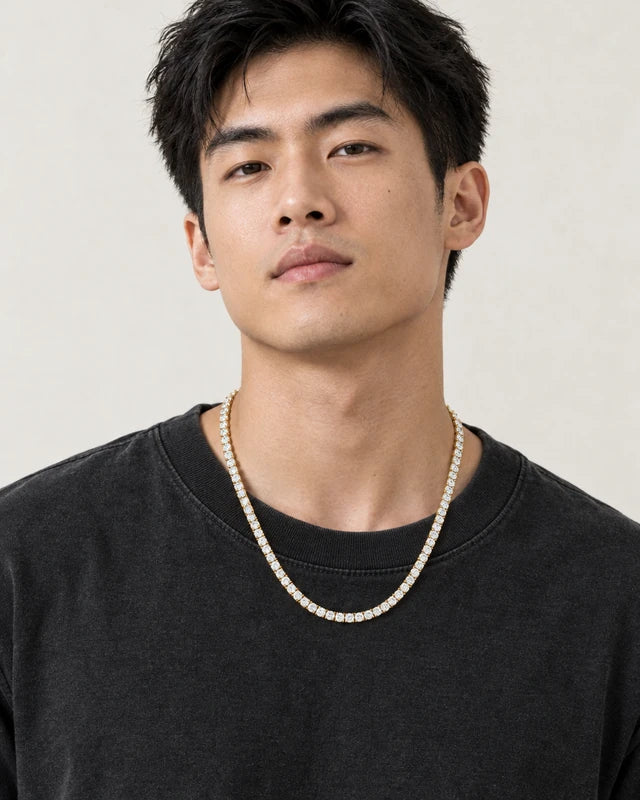 Model wearing the Frost Asia moissanite tennis chain in a yellow-metal finish