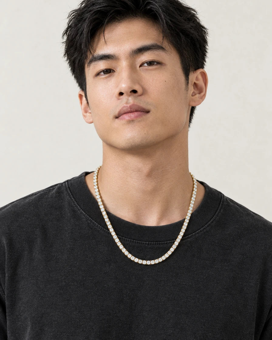 Model wearing the Frost Asia moissanite tennis chain in a yellow-metal finish