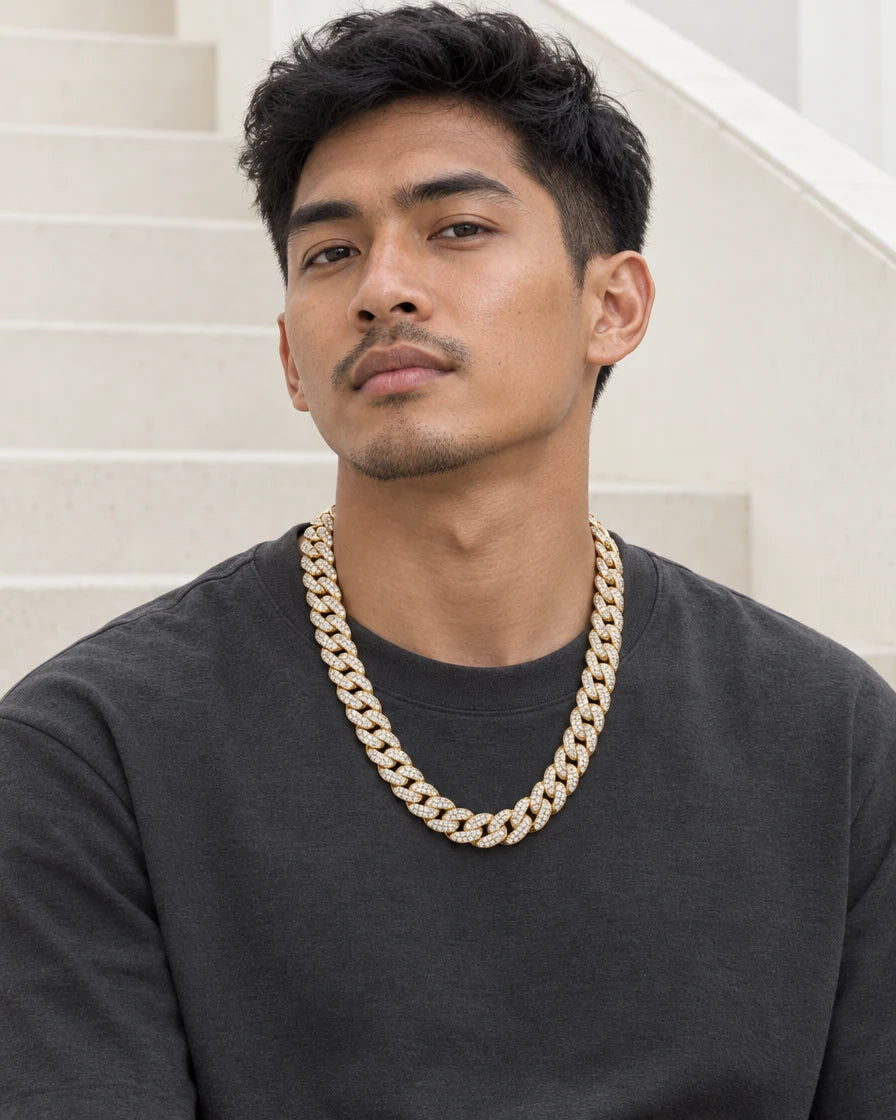 Model wearing the Frost Asia moissanite Cuban link chain in a yellow-metal finish