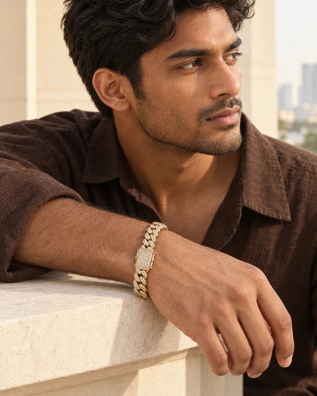 Model wearing the Frost Asia moissanite Cuban link bracelet in a yellow-metal finish