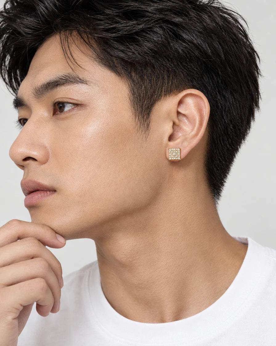 Model wearing the Frost Asia square moissanite stud earring in a yellow-metal finish